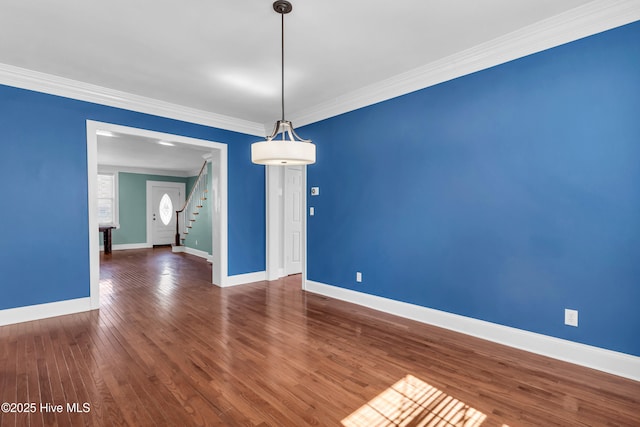 114 N 16th St, Wilmington, NC 28401 - empty room featuring crown molding, stairway, and wood-type flooring