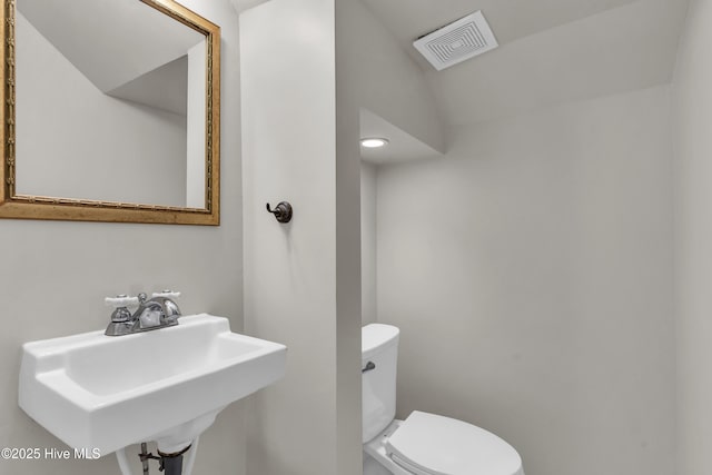 114 N 16th St, Wilmington, NC 28401 - half bath featuring toilet and a sink