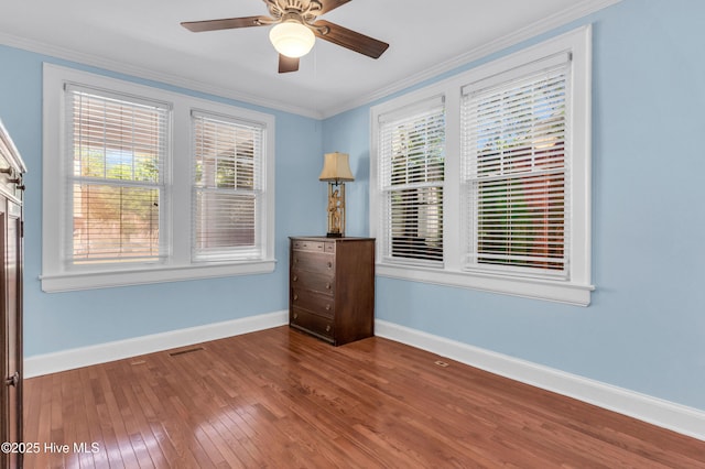 114 N 16th St, Wilmington, NC 28401 - unfurnished bedroom with wood-type flooring, ornamental molding, and ceiling fan