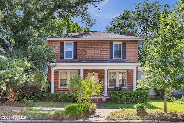 114 N 16th St, Wilmington, NC 28401 - view of front of property featuring a chimney, covered porch, and brick siding