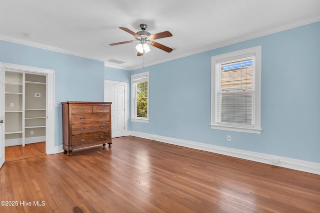 114 N 16th St, Wilmington, NC 28401 - bedroom with wood-type flooring, a closet, ornamental molding, and a ceiling fan