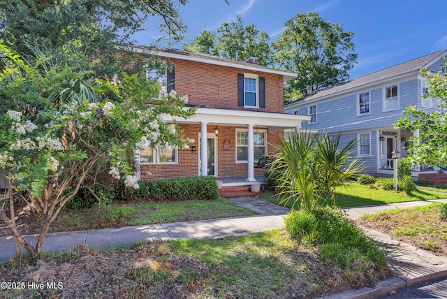 114 N 16th St, Wilmington, NC 28401 - view of front of property with brick siding and a porch