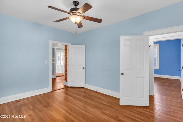 114 N 16th St, Wilmington, NC 28401 - unfurnished bedroom with wood-type flooring and a ceiling fan
