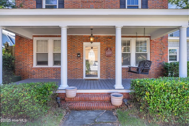114 N 16th St, Wilmington, NC 28401 - doorway to property with a porch and brick siding