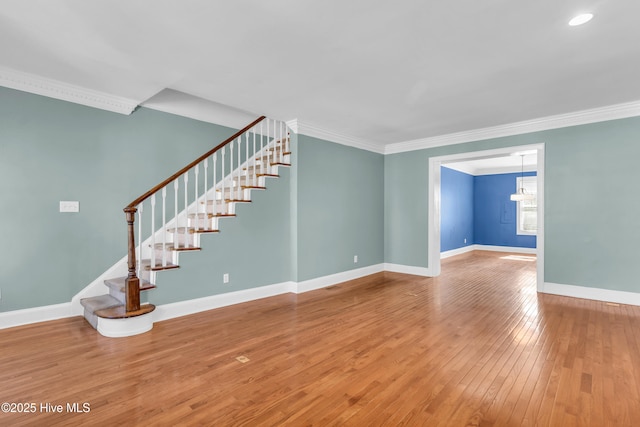 114 N 16th St, Wilmington, NC 28401 - unfurnished living room featuring stairway, ornamental molding, and hardwood / wood-style flooring