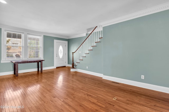 114 N 16th St, Wilmington, NC 28401 - entrance foyer featuring ornamental molding, hardwood / wood-style floors, and stairs