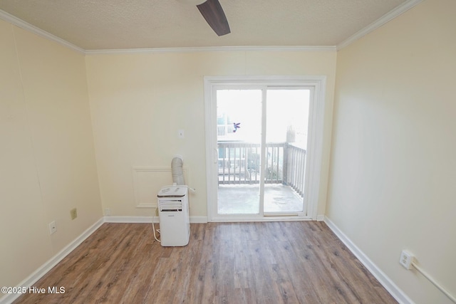 2264 New River Inlet Rd Unit 210, North Topsail Beach, NC 28460 - unfurnished room featuring wood finished floors, ornamental molding, baseboards, a textured ceiling, and a ceiling fan