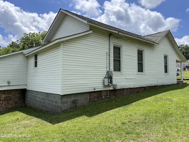 106 W Barrett St, Carthage, NC 28327 - view of home's exterior featuring a yard, crawl space, and a shingled roof