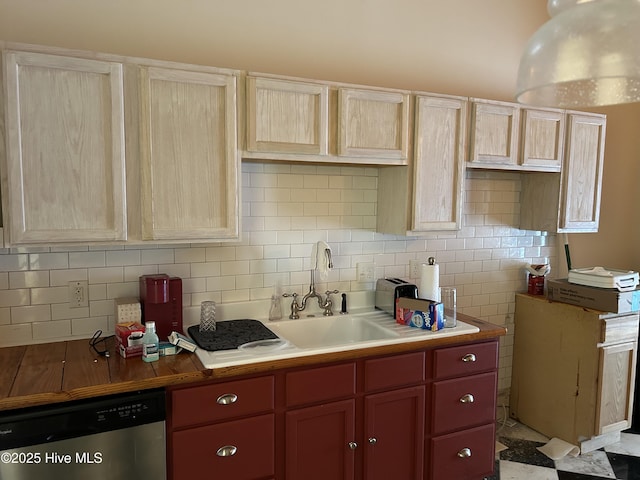 106 W Barrett St, Carthage, NC 28327 - kitchen with stainless steel dishwasher, a sink, and decorative backsplash