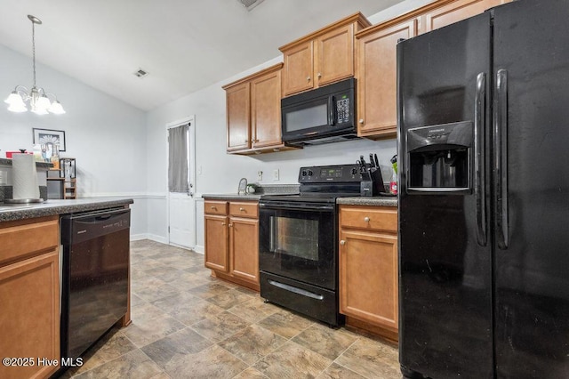 213 Lockwood Ct, Hubert, NC 28539 - kitchen featuring black appliances, vaulted ceiling, dark countertops, a chandelier, and brown cabinets