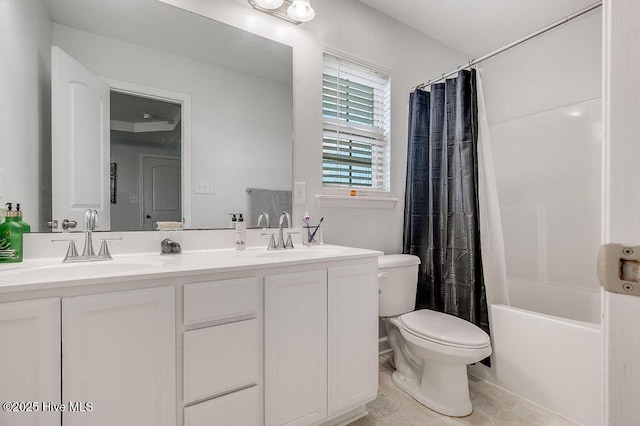 213 Lockwood Ct, Hubert, NC 28539 - bathroom featuring toilet, double vanity, shower / bath combo with shower curtain, and tile patterned flooring