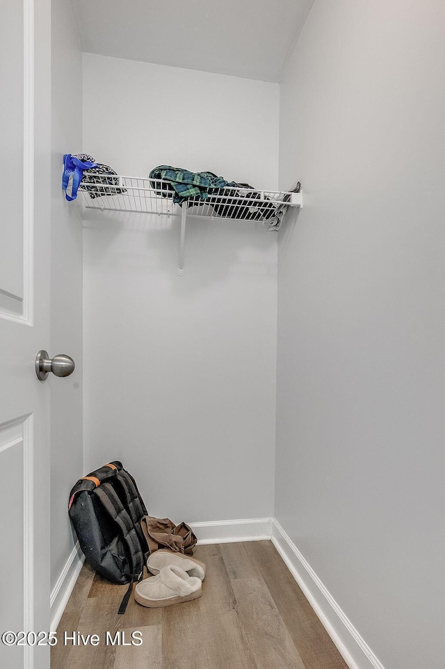 213 Lockwood Ct, Hubert, NC 28539 - walk in closet featuring wood finished floors