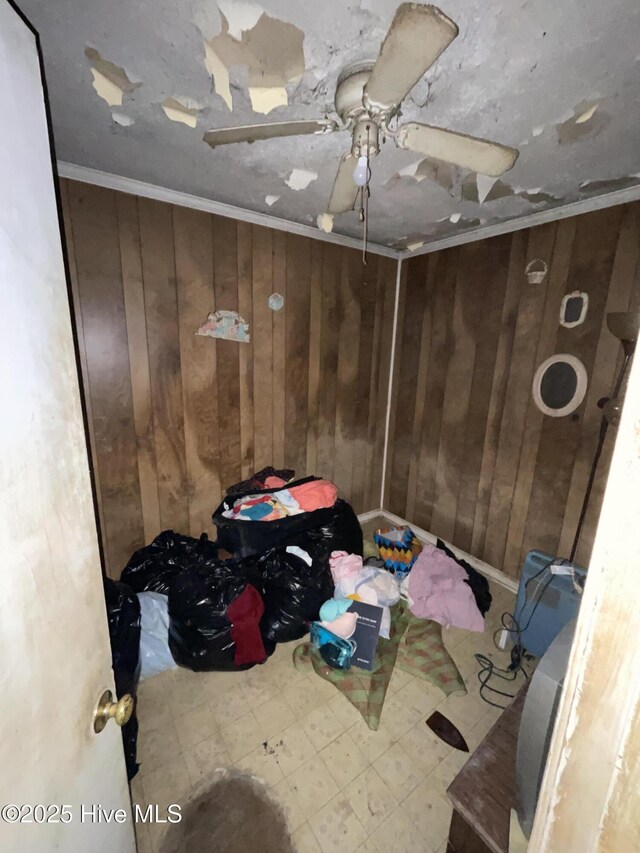 512 Walton Ln, Tyner, NC 27980 - unfurnished bedroom with wooden walls, ornamental molding, tile patterned floors, and a ceiling fan