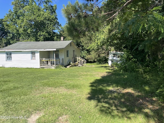 512 Walton Ln, Tyner, NC 27980 - view of grassy yard featuring a porch