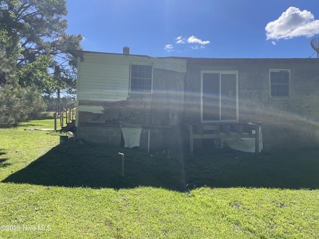 512 Walton Ln, Tyner, NC 27980 - rear view of house featuring a yard