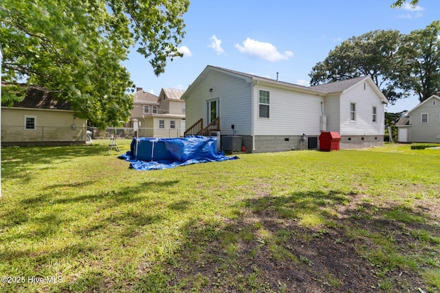 406 Walnut St, Elizabeth City, NC 27909 - rear view of property featuring crawl space and central AC unit