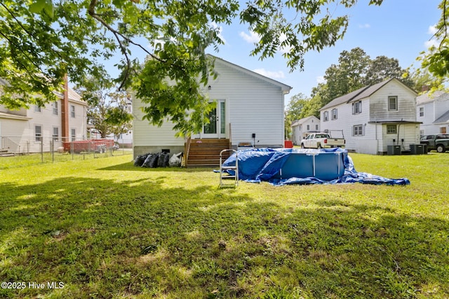 406 Walnut St, Elizabeth City, NC 27909 - view of yard featuring a covered pool, cooling unit, and a residential view