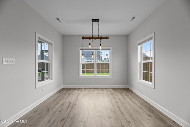 2001 Snapper St, New Bern, NC 28562 - unfurnished dining area featuring wood finished floors and baseboards