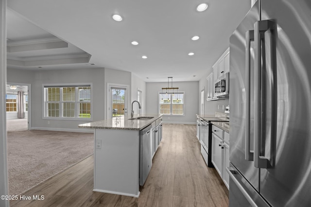 2001 Snapper St, New Bern, NC 28562 - kitchen with appliances with stainless steel finishes, a sink, recessed lighting, baseboards, and an island with sink