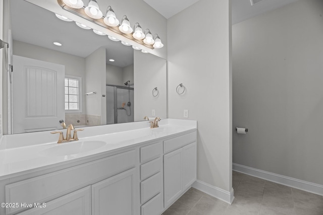2001 Snapper St, New Bern, NC 28562 - bathroom with double vanity, a stall shower, tile patterned floors, and baseboards