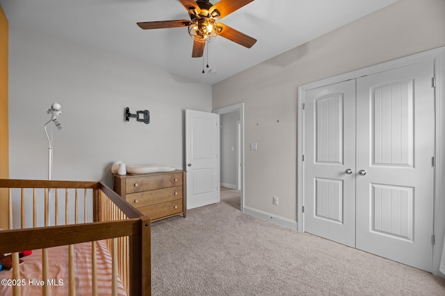 2001 Snapper St, New Bern, NC 28562 - carpeted bedroom featuring a closet, a crib, baseboards, and ceiling fan