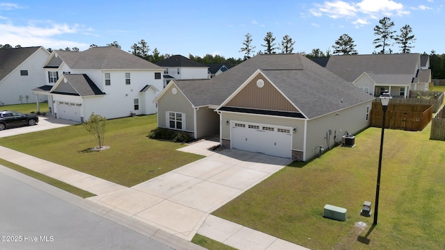 2001 Snapper St, New Bern, NC 28562 - view of front of house with central AC, an attached garage, driveway, stone siding, and a residential view
