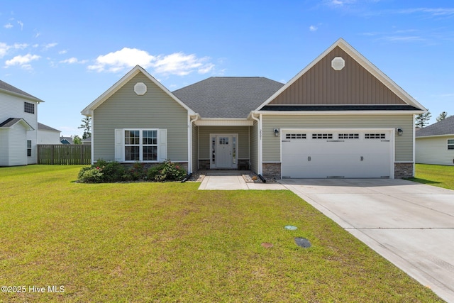 2001 Snapper St, New Bern, NC 28562 - view of front facade with board and batten siding, an attached garage, stone siding, and concrete driveway