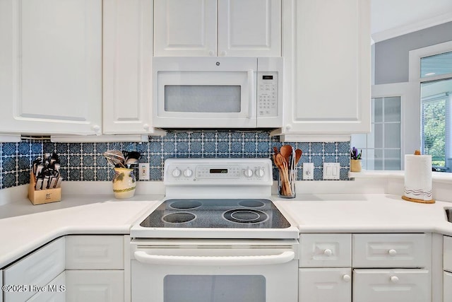 3212 Wexford Way, Southport, NC 28461 - kitchen featuring white appliances, white cabinets, light countertops, and decorative backsplash