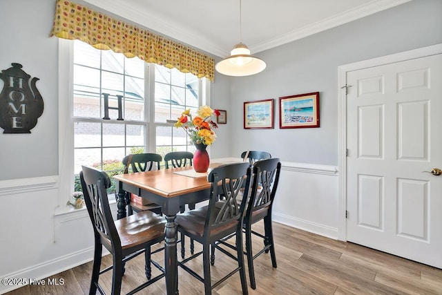 3212 Wexford Way, Southport, NC 28461 - dining room with crown molding, light wood-style floors, and plenty of natural light