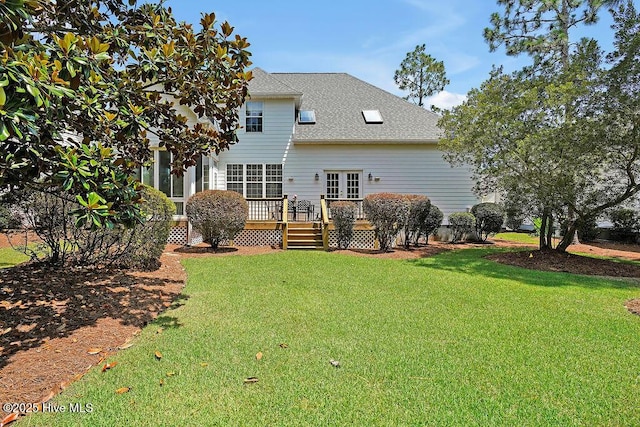 3212 Wexford Way, Southport, NC 28461 - back of property featuring a deck, a yard, and roof with shingles