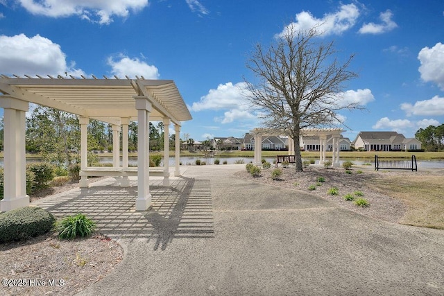 3212 Wexford Way, Southport, NC 28461 - view of patio / terrace featuring a pergola, a residential view, and a water view