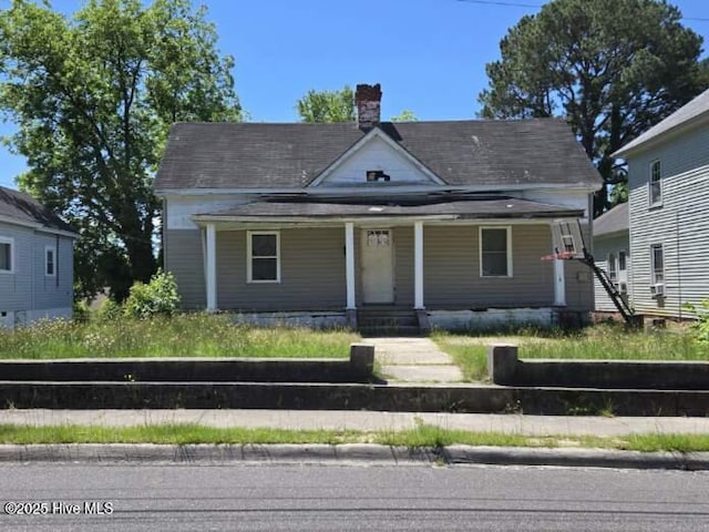 714 Leak St, Rockingham, NC 28379 - view of front of property featuring covered porch and a chimney