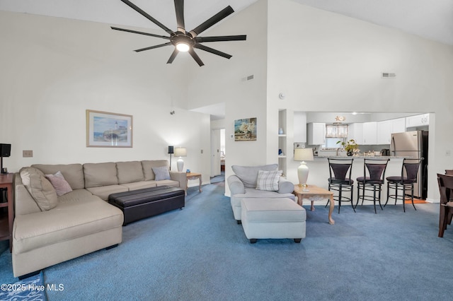 728 Azalea Dr Unit 426, Hampstead, NC 28443 - living room with high vaulted ceiling, ceiling fan, and carpet flooring