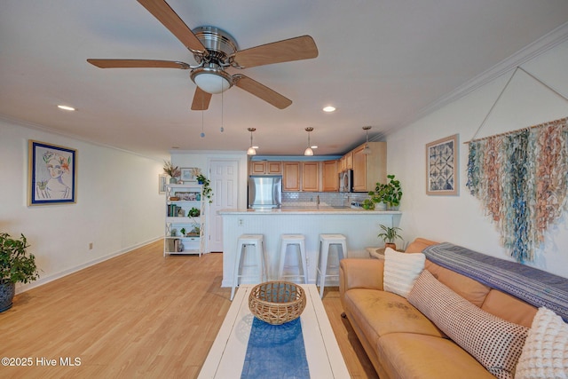 909 Carolina Beach Ave N Unit 2B, Carolina Beach, NC 28428 - living area with ornamental molding, recessed lighting, light wood finished floors, ceiling fan, and baseboards