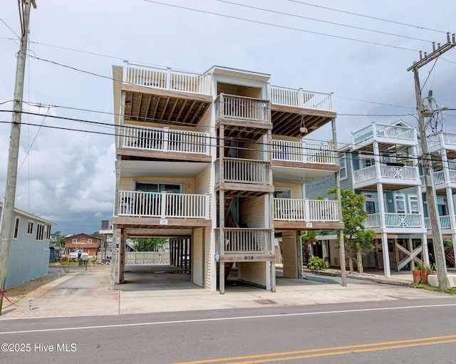 909 Carolina Beach Ave N Unit 2B, Carolina Beach, NC 28428 - view of building exterior with a carport