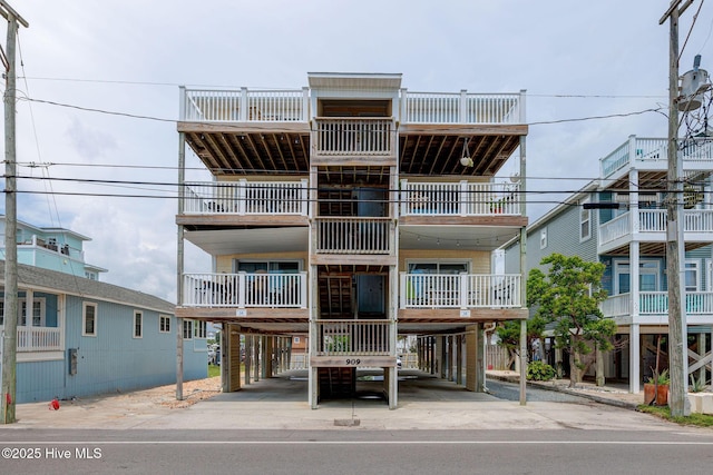 909 Carolina Beach Ave N Unit 2B, Carolina Beach, NC 28428 - view of property featuring a carport and concrete driveway