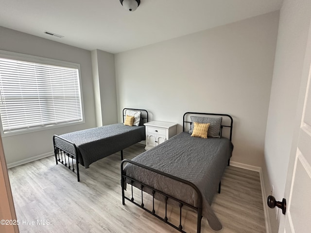 8288 Paramount Pt, Winnabow, NC 28479 - bedroom with light wood-style floors and baseboards
