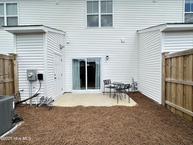 8288 Paramount Pt, Winnabow, NC 28479 - rear view of house featuring a fenced backyard, a patio area, and central AC unit
