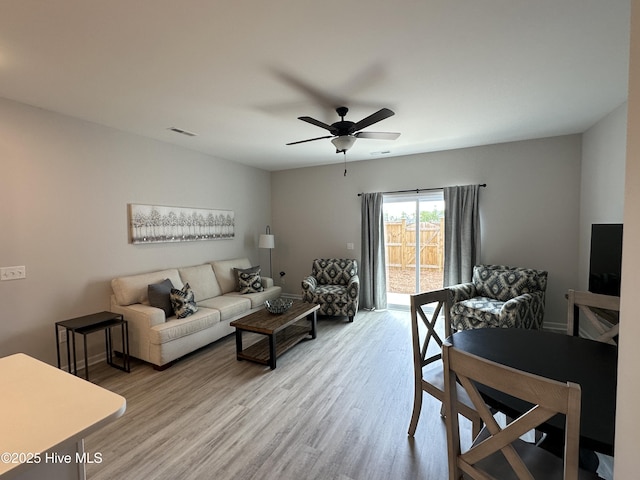 8288 Paramount Pt, Winnabow, NC 28479 - living area with wood finished floors, a ceiling fan, and baseboards