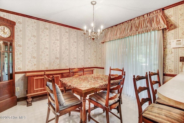 102 Trollingwood Dr, Goldsboro, NC 27534 - dining space with wallpapered walls, a chandelier, light flooring, wainscoting, and crown molding