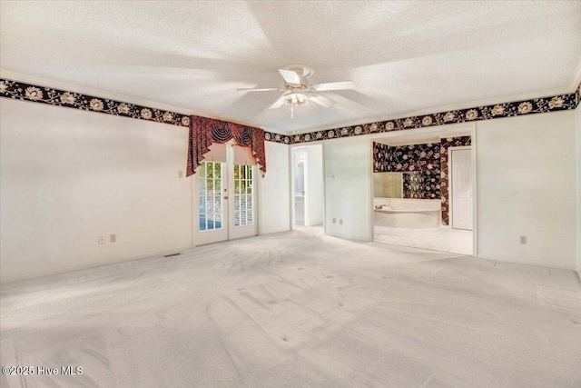 102 Trollingwood Dr, Goldsboro, NC 27534 - carpeted spare room featuring french doors, ceiling fan, a textured ceiling, and ornamental molding