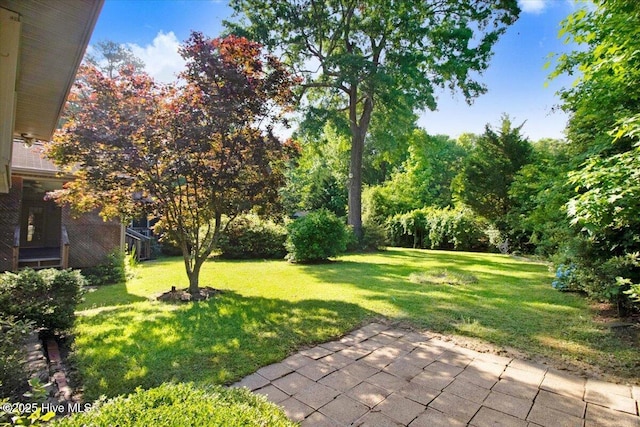 102 Trollingwood Dr, Goldsboro, NC 27534 - view of green lawn with a patio area