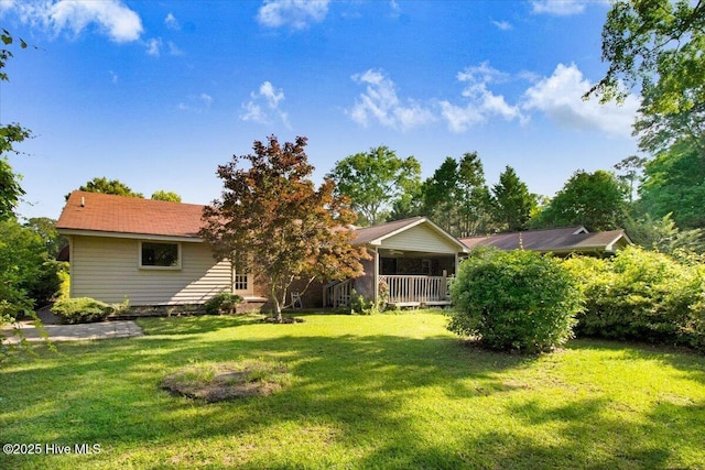 102 Trollingwood Dr, Goldsboro, NC 27534 - rear view of property with a lawn and covered porch