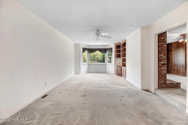 102 Trollingwood Dr, Goldsboro, NC 27534 - unfurnished living room featuring a ceiling fan, carpet flooring, a textured ceiling, and baseboards