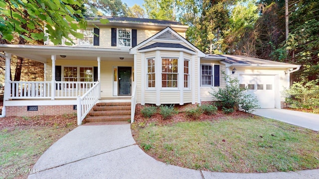 165 Sandhurst Pl, Southern Pines, NC 28387 - traditional-style house featuring covered porch, an attached garage, and driveway