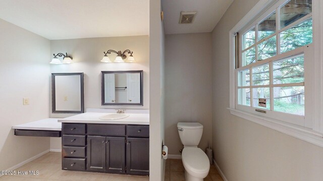 165 Sandhurst Pl, Southern Pines, NC 28387 - bathroom with plenty of natural light, vanity, baseboards, and tile patterned floors