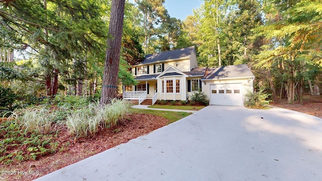 165 Sandhurst Pl, Southern Pines, NC 28387 - view of front of house with a porch, a garage, and concrete driveway
