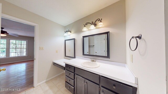 165 Sandhurst Pl, Southern Pines, NC 28387 - bathroom featuring vanity, ceiling fan, baseboards, and tile patterned floors