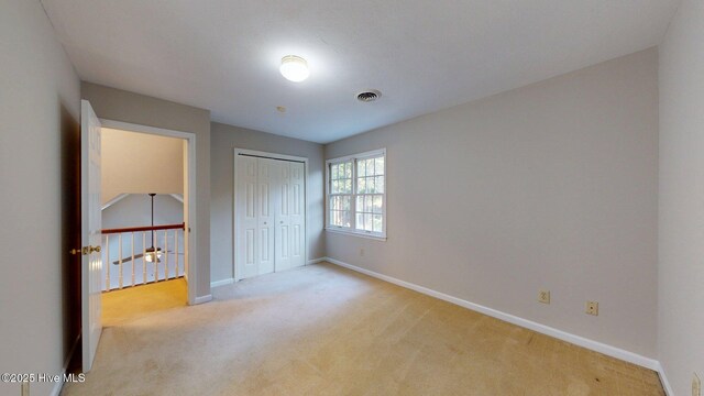 165 Sandhurst Pl, Southern Pines, NC 28387 - unfurnished bedroom featuring carpet floors, baseboards, and a closet