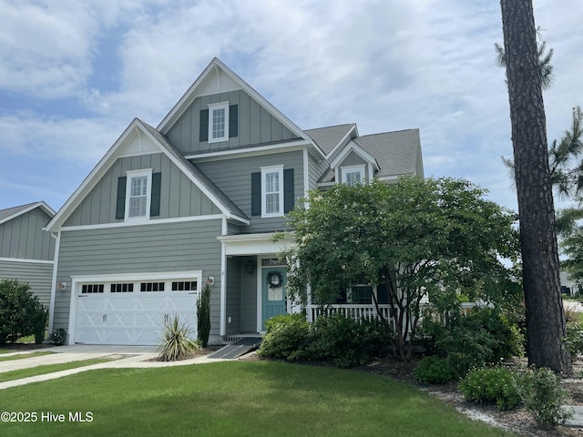 8395 Penny Royal Ln, Wilmington, NC 28412 - view of front of property with board and batten siding, an attached garage, a front yard, a porch, and driveway